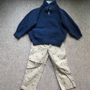 Dinosaur pants and blue sweater, boys